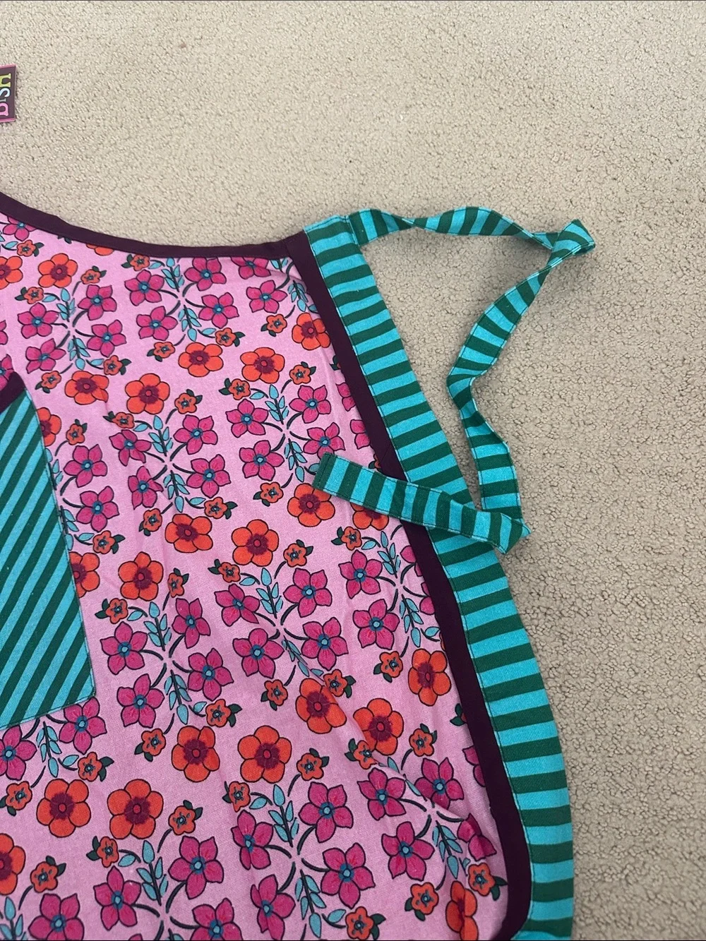 Whimsical Pink Floral Apron with Teal Striped Pocket